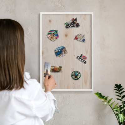 Magnetic board for travel magnets in a white frame Wooden pattern