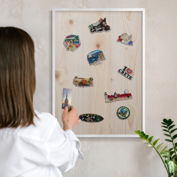 Magnetic board for travel magnets in a white frame Wooden pattern