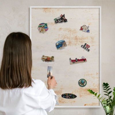 Magnetic board for travel magnets in a white frame Rusty texture