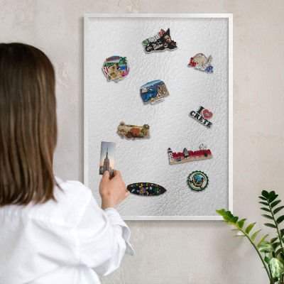 Magnetic board for travel magnets in a white frame Elegant texture