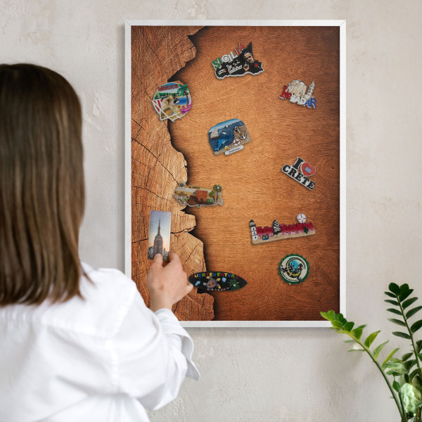 Magnetic board for travel magnets in a white frame Wooden texture