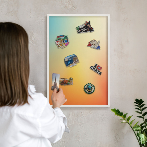Magnetic board for travel magnets in a white frame Color transition