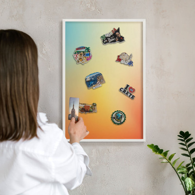 Magnetic board for travel magnets in a white frame Color transition