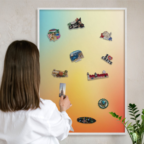 Magnetic board for travel magnets in a white frame Color transition