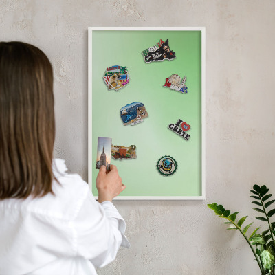 Magnetic board for travel magnets in a white frame Green harmony