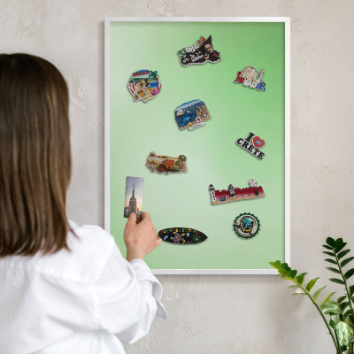 Magnetic board for travel magnets in a white frame Green harmony