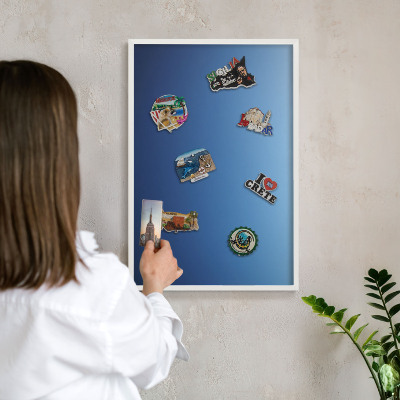 Magnetic board for travel magnets in a white frame Blue gradients