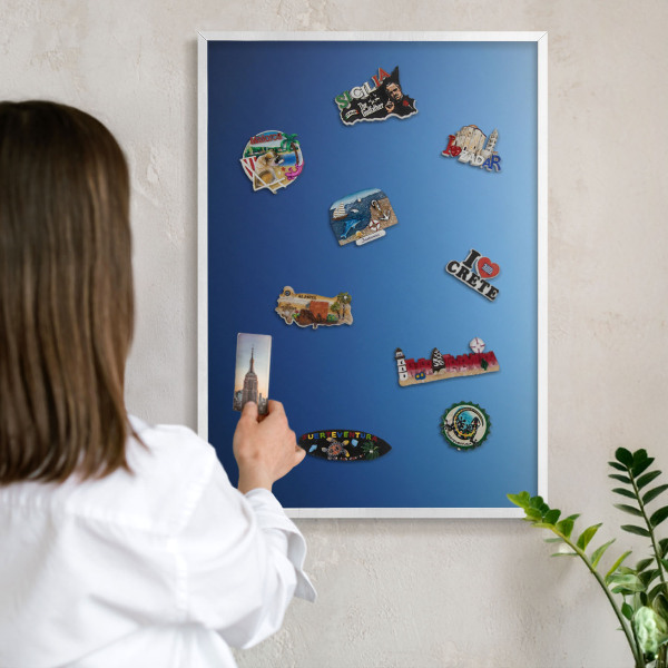 Magnetic board for travel magnets in a white frame Blue gradients