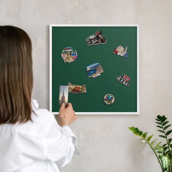 Magnetic board for travel magnets in a white frame Bottle green