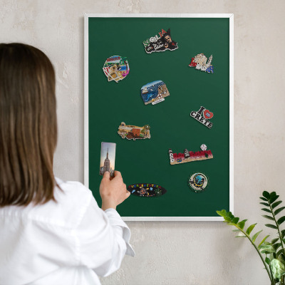 Magnetic board for travel magnets in a white frame Bottle green