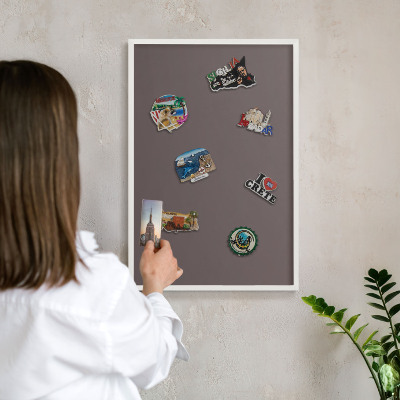 Magnetic board for travel magnets in a white frame Faded brown