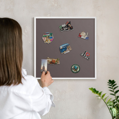 Magnetic board for travel magnets in a white frame Faded brown