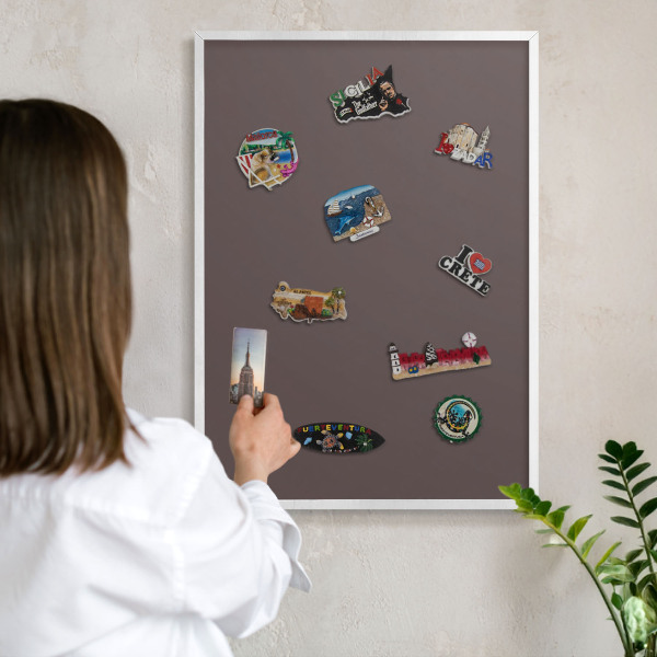 Magnetic board for travel magnets in a white frame Faded brown