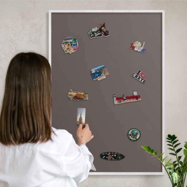 Magnetic board for travel magnets in a white frame Faded brown
