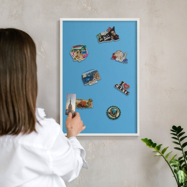 Decorative magnet board with a white frame Blue water