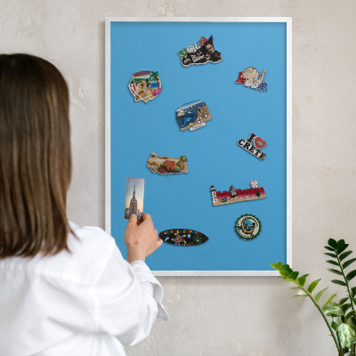 Decorative magnet board with a white frame Blue water