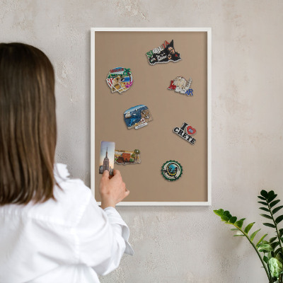 Magnetic board for travel magnets in a white frame Warm light brown