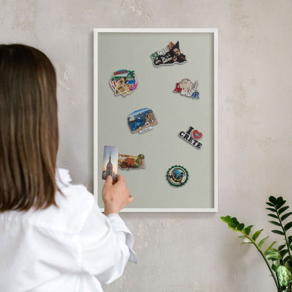 Magnetic board for travel magnets in a white frame Warm gray
