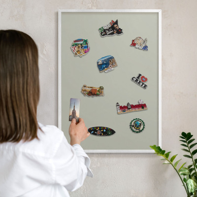 Magnetic board for travel magnets in a white frame Warm gray
