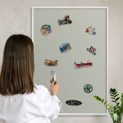 Magnetic board for travel magnets in a white frame Warm gray