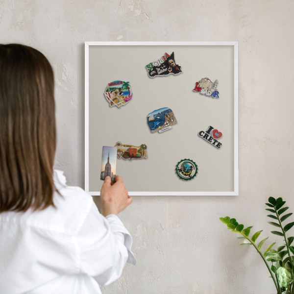 Magnetic board for travel magnets in a white frame Warm stone