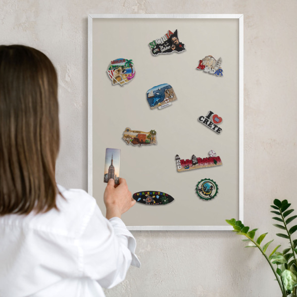 Magnetic board for travel magnets in a white frame Warm stone