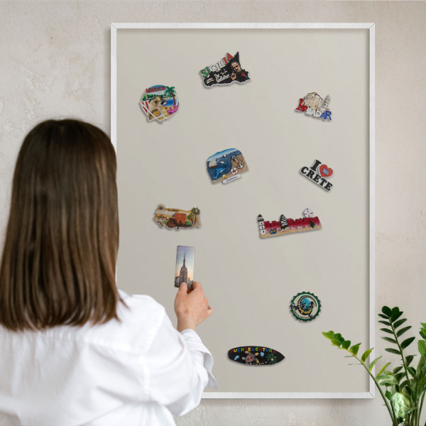 Magnetic board for travel magnets in a white frame Warm stone