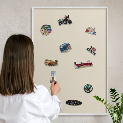Magnetic board for travel magnets in a white frame Light stone