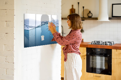 Magnetic dry erase board Water background with photos and accessories