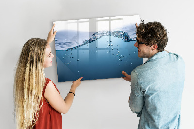 Magnetic dry erase board Water background with photos and accessories