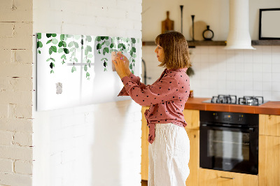 Dry erase board magnetic Green leaves and photos on the wall