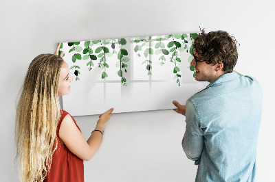 Dry erase board magnetic Green leaves and photos on the wall