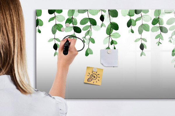 Dry erase board magnetic Green leaves and photos on the wall