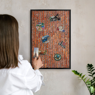 Metal wall board for magnets in a black frame Brick motif