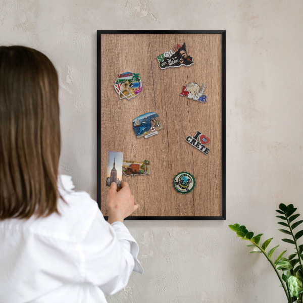 Metal wall board for magnets in a black frame Wood texture
