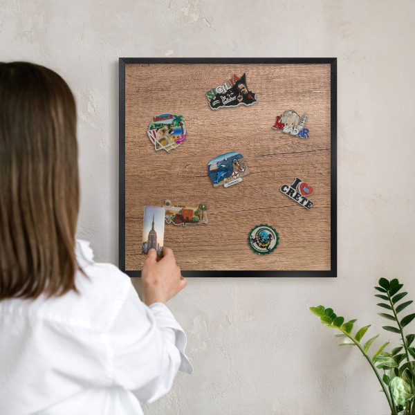 Metal wall board for magnets in a black frame Wood texture