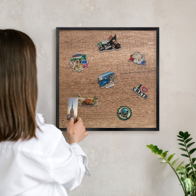 Metal wall board for magnets in a black frame Wood texture