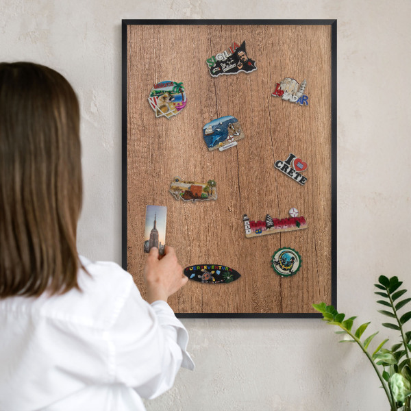 Metal wall board for magnets in a black frame Wood texture