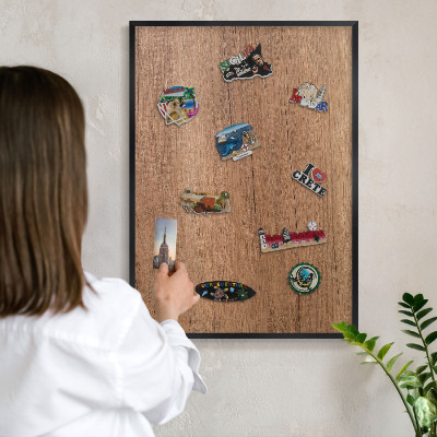 Metal wall board for magnets in a black frame Wood texture