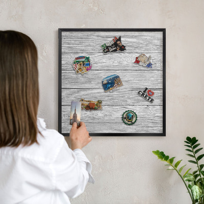 Vacation magnet board with a black frame Wooden texture
