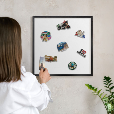Metal wall board for magnets in a black frame Pure white