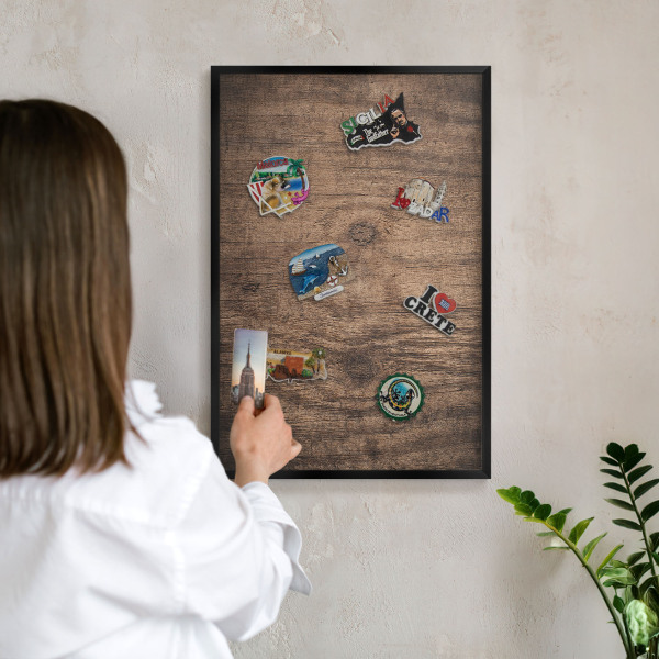 Vacation magnet board with a black frame Wooden texture