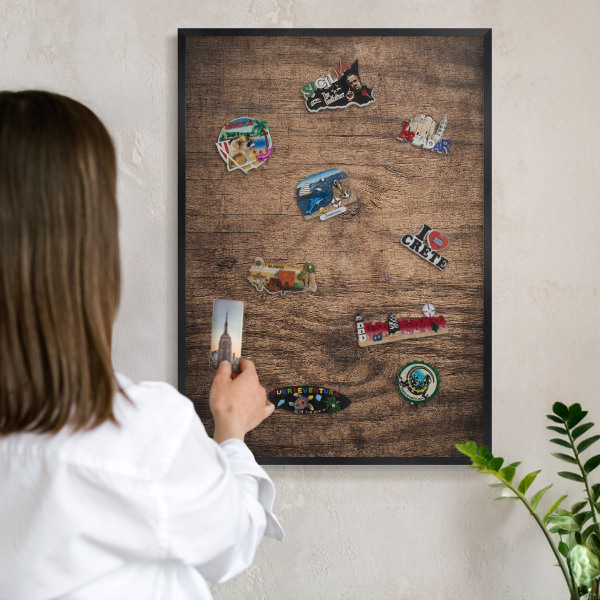 Vacation magnet board with a black frame Wooden texture