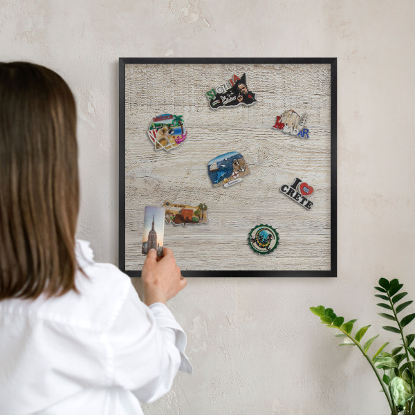 Vacation magnet board with a black frame Wooden texture