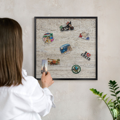 Vacation magnet board with a black frame Wooden texture