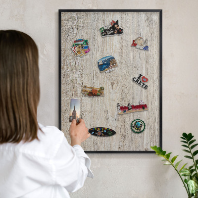 Vacation magnet board with a black frame Wooden texture