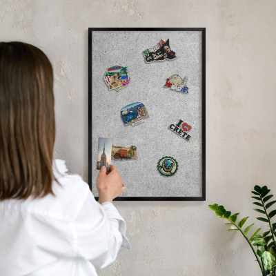 Vacation magnet board with a black frame Gray texture