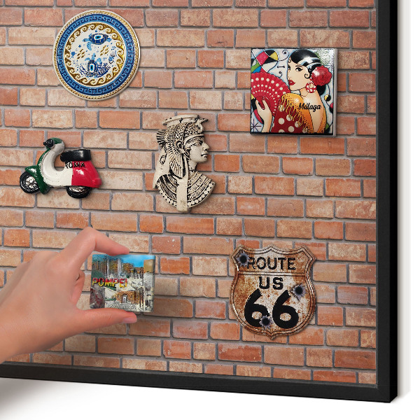 Metal wall board for magnets in a black frame Brick wall