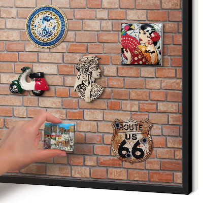 Metal wall board for magnets in a black frame Brick wall