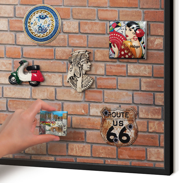 Metal wall board for magnets in a black frame Brick wall